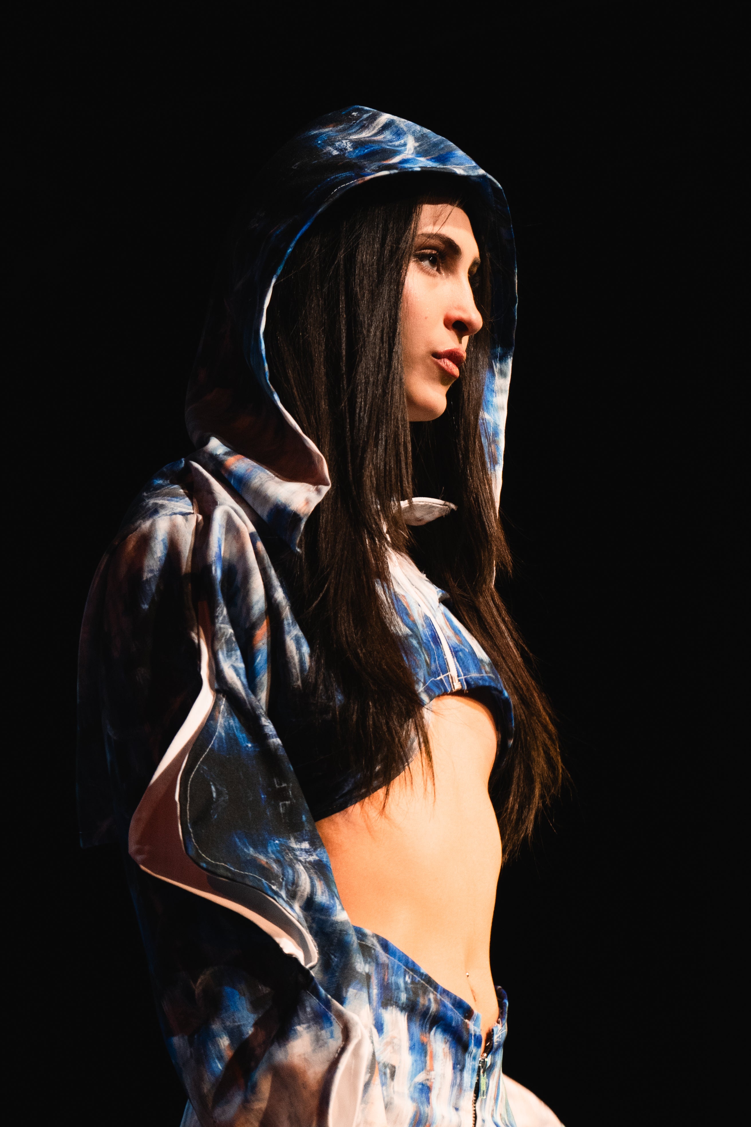 Person wearing a blue and white patterned hoodie